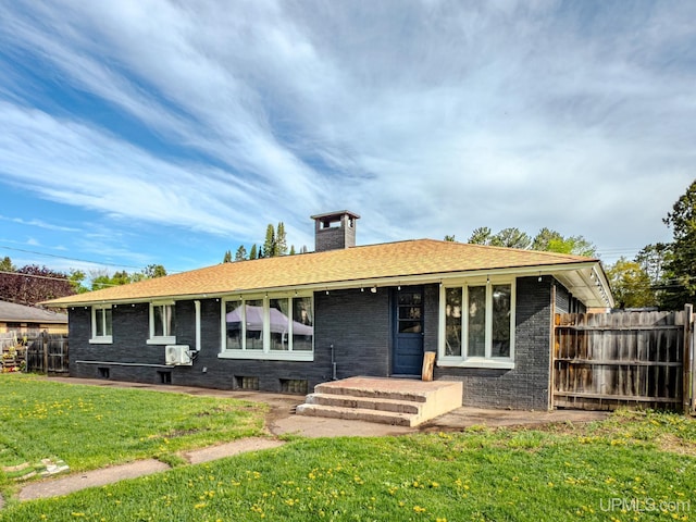 103 W Michigan Ave, Ironwood, MI 49938 - back of property featuring a chimney and brick siding