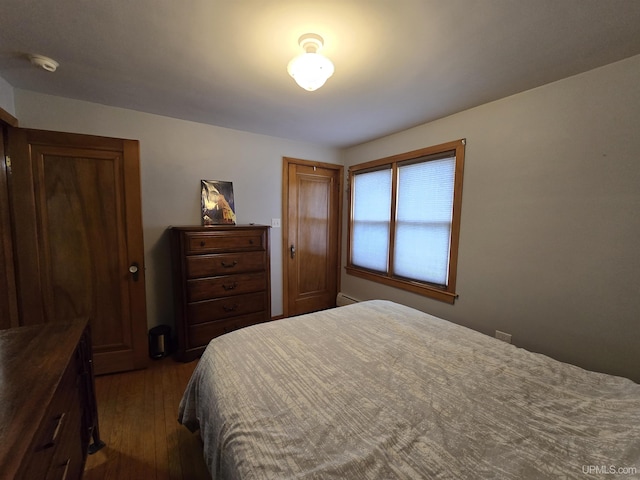 817 W Water St, Hancock, MI 49930 - bedroom featuring dark wood-type flooring and baseboard heating
