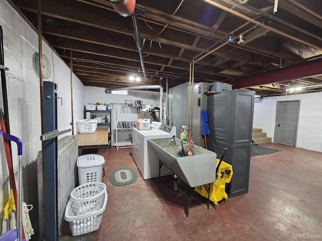 817 W Water St, Hancock, MI 49930 - unfinished below grade area featuring washer and clothes dryer, stairs, and a sink