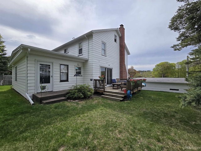 817 W Water St, Hancock, MI 49930 - rear view of house with a chimney, a lawn, and a deck