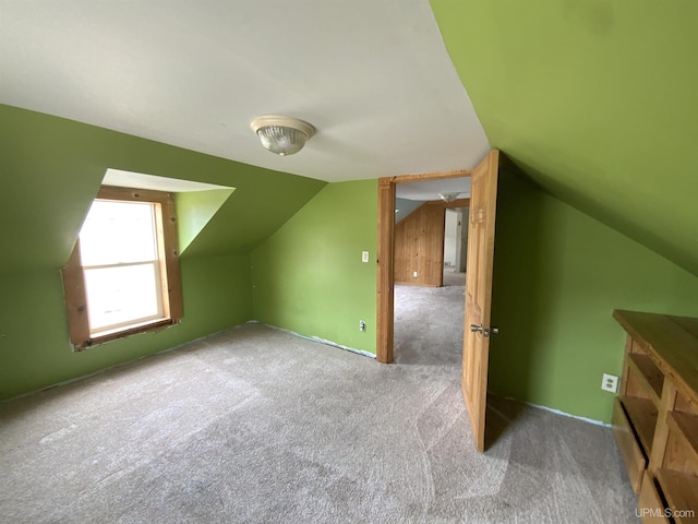 331 W Bluff St, Marquette, MI 49855 - additional living space with vaulted ceiling and carpet floors