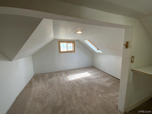 331 W Bluff St, Marquette, MI 49855 - bonus room with lofted ceiling, carpet floors, and a skylight