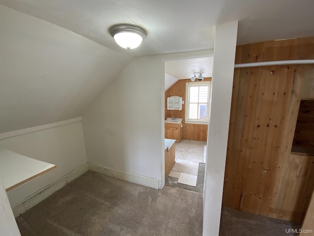 331 W Bluff St, Marquette, MI 49855 - additional living space featuring vaulted ceiling and carpet floors