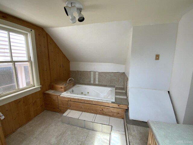 331 W Bluff St, Marquette, MI 49855 - full bathroom featuring a whirlpool tub, vaulted ceiling, and wood walls