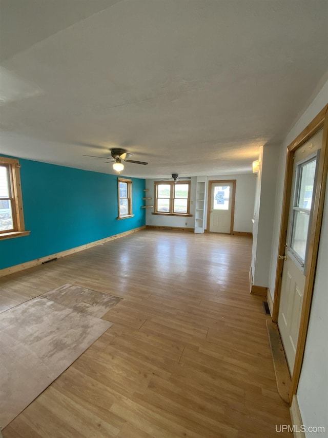 331 W Bluff St, Marquette, MI 49855 - unfurnished room with light wood-type flooring, baseboards, and a ceiling fan