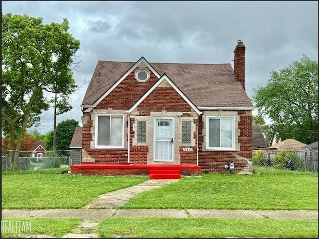 14840 Eastburn St, Detroit, MI 48205 - view of front of property featuring a shingled roof, brick siding, and a chimney