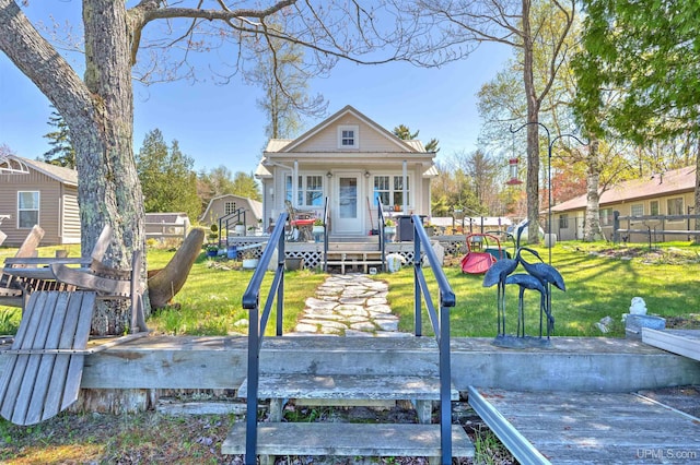 546N W Gulliver Lake Rd, Gulliver, MI 49840 - view of front facade featuring a front lawn