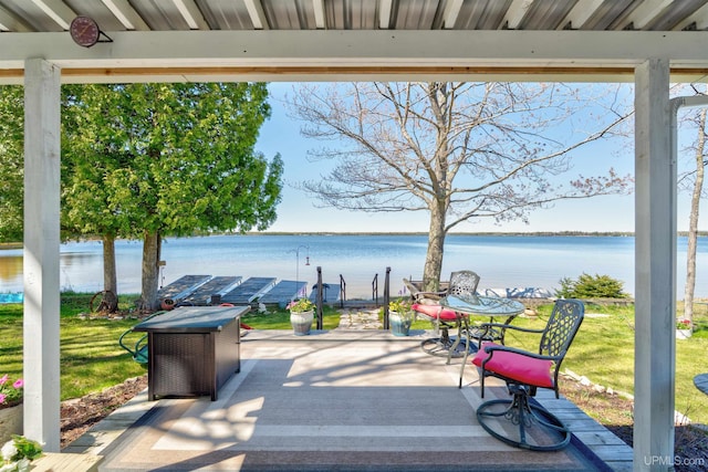 546N W Gulliver Lake Rd, Gulliver, MI 49840 - view of patio with a water view