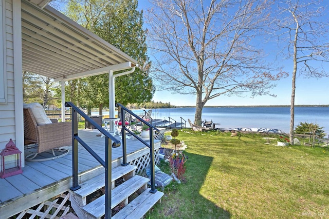 546N W Gulliver Lake Rd, Gulliver, MI 49840 - view of grassy yard featuring a deck with water view