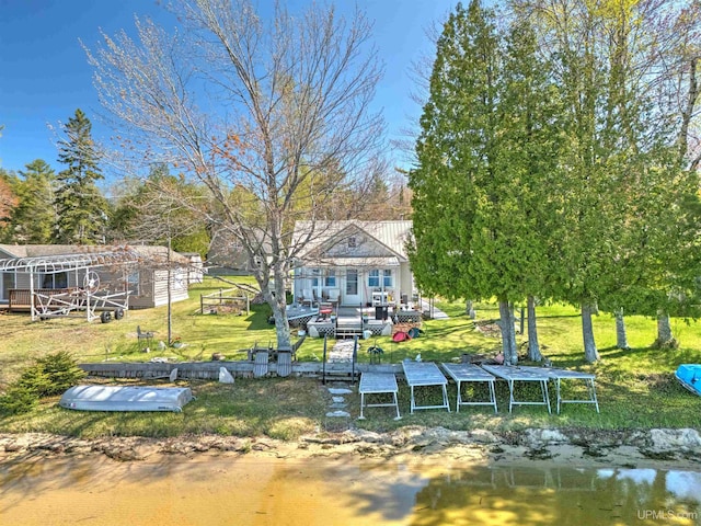 546N W Gulliver Lake Rd, Gulliver, MI 49840 - dock with a deck with water view and a lawn