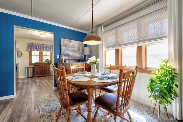 546N W Gulliver Lake Rd, Gulliver, MI 49840 - dining space with ornamental molding, baseboards, and hardwood / wood-style flooring