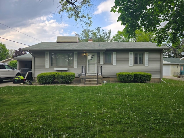 711 Moore St, Owosso, MI 48867 - single story home featuring a front yard and a chimney
