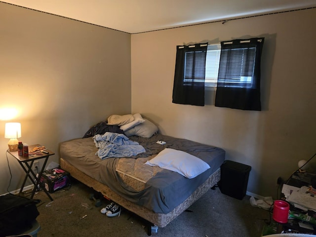 711 Moore St, Owosso, MI 48867 - carpeted bedroom featuring baseboards
