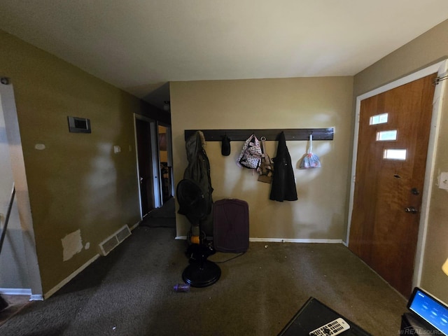 711 Moore St, Owosso, MI 48867 - carpeted foyer entrance featuring baseboards