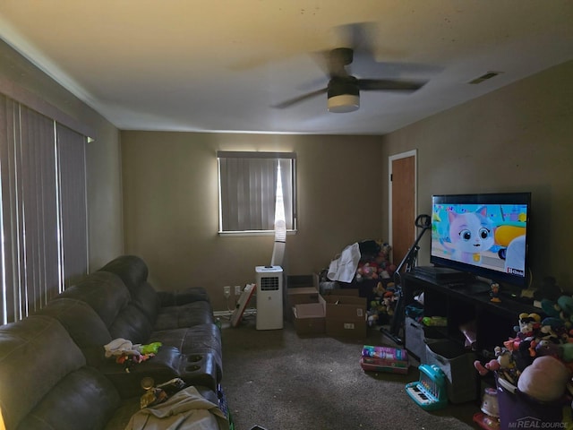 711 Moore St, Owosso, MI 48867 - carpeted living room with a ceiling fan