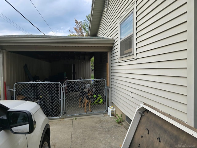 711 Moore St, Owosso, MI 48867 - view of side of home featuring a gate