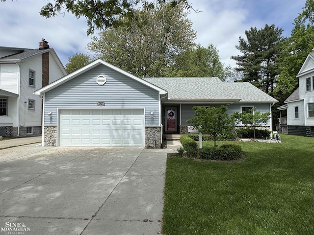 1741 Saint Clair River Dr, Algonac, MI 48001 - view of front of home with concrete driveway, an attached garage, a front lawn, stone siding, and a shingled roof