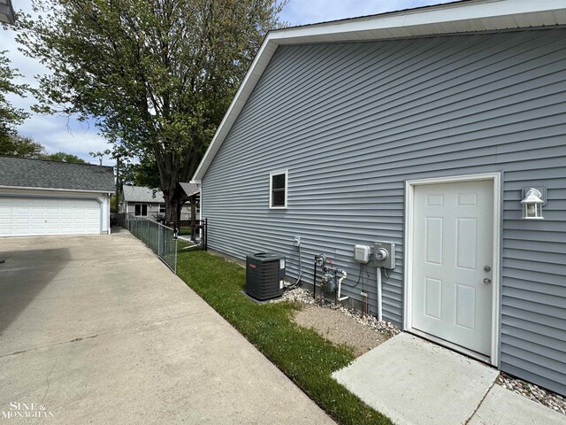 1741 Saint Clair River Dr, Algonac, MI 48001 - view of side of property featuring cooling unit and an outdoor structure