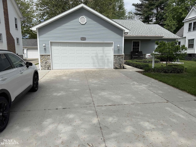 1741 Saint Clair River Dr, Algonac, MI 48001 - single story home featuring stone siding, driveway, and a garage