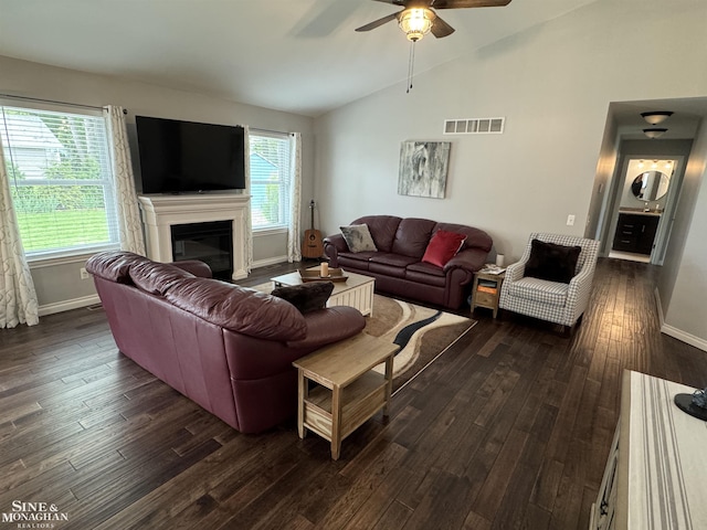 1741 Saint Clair River Dr, Algonac, MI 48001 - living area with lofted ceiling, baseboards, a ceiling fan, dark wood finished floors, and a glass covered fireplace