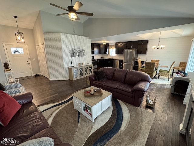 1741 Saint Clair River Dr, Algonac, MI 48001 - living area with dark wood-style flooring, ceiling fan, a chandelier, high vaulted ceiling, and baseboards