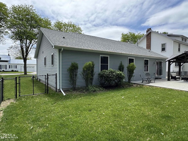 1741 Saint Clair River Dr, Algonac, MI 48001 - back of property featuring a gazebo, a gate, a patio, a shingled roof, and a chimney