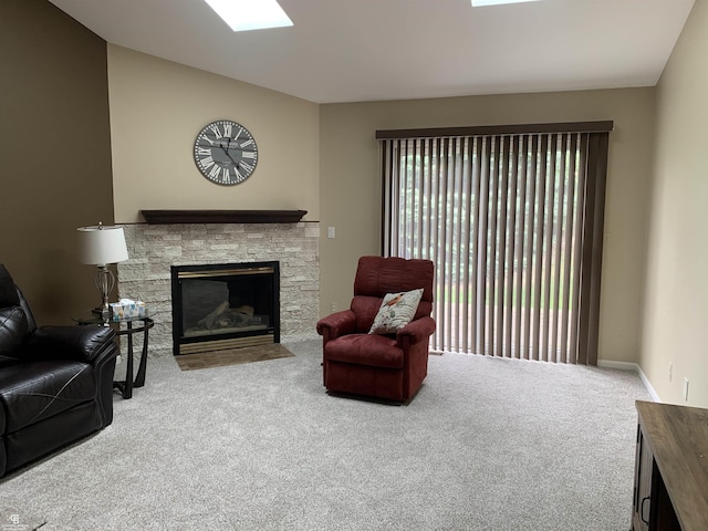 13304 Highland Cir, Sterling Heights, MI 48312 - carpeted living area with a fireplace, a skylight, and vaulted ceiling