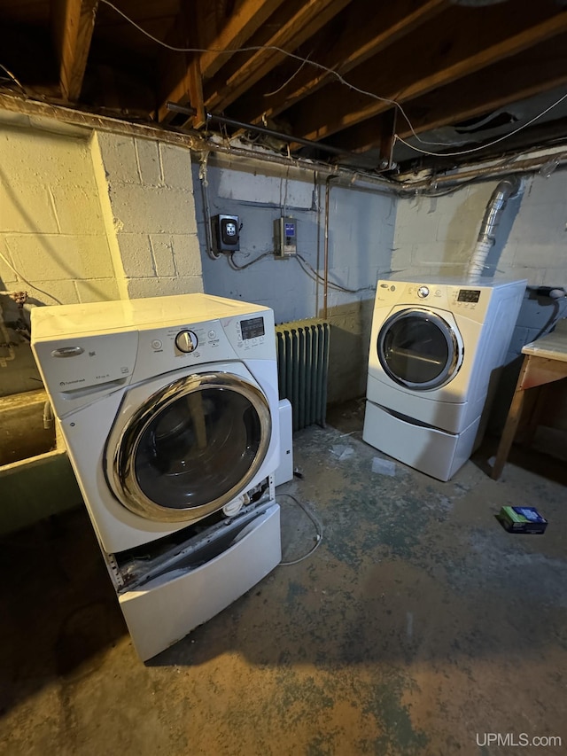 584 Elliott Ave, Ishpeming, MI 49849 - laundry room with washer and dryer and radiator heating unit