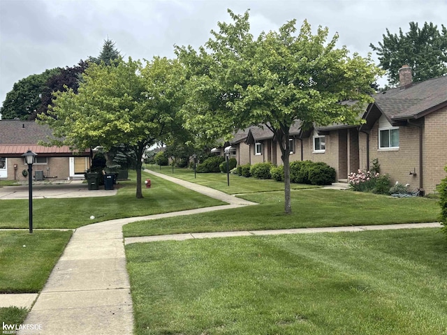 8401 18 Mile Rd Unit 154, Sterling Heights, MI 48313 - view of home's community featuring a yard