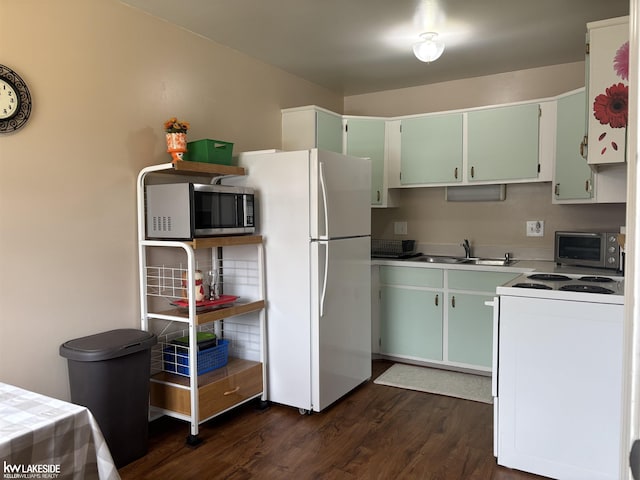 8401 18 Mile Rd Unit 154, Sterling Heights, MI 48313 - kitchen featuring white appliances, dark wood-style floors, a sink, and light countertops