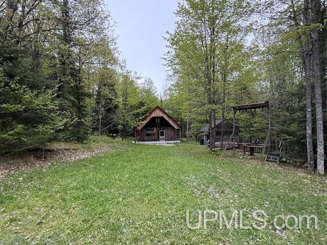 325 Mastodon Rd, Crystal Falls, MI 49920 - view of green lawn featuring a barn