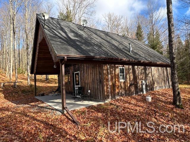 325 Mastodon Rd, Crystal Falls, MI 49920 - view of side of home with a patio area
