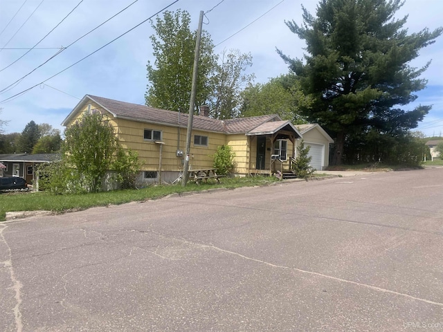210 Birch St, Hancock, MI 49930 - view of front of home with a garage
