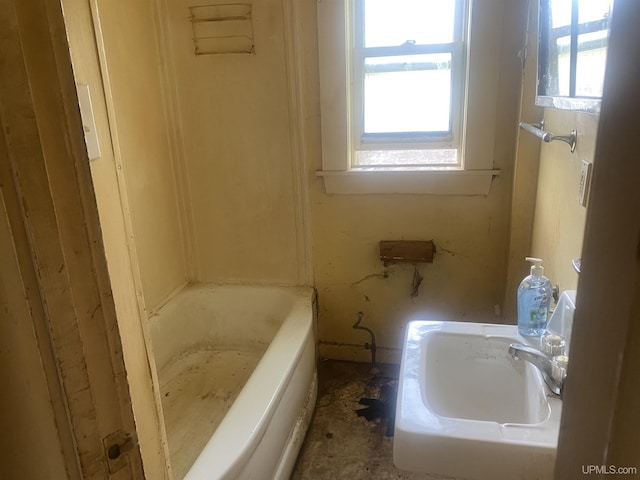 210 Birch St, Hancock, MI 49930 - full bath featuring plenty of natural light, a tub to relax in, and a sink