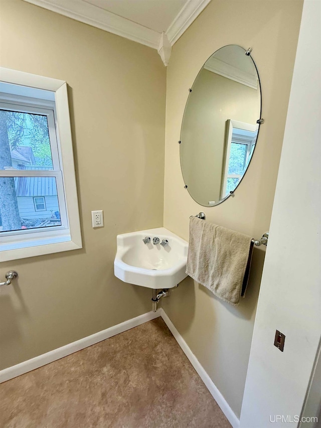 300 Jasper St, Ishpeming, MI 49849 - bathroom featuring ornamental molding, baseboards, and a sink