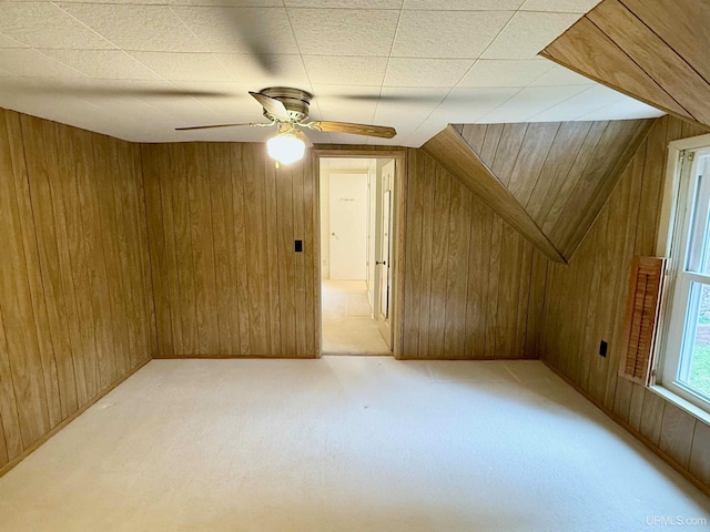300 Jasper St, Ishpeming, MI 49849 - additional living space featuring wooden walls, light colored carpet, and ceiling fan