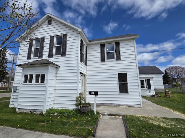 601 Range St, Manistique, MI 49854 - view of front of house with a front lawn