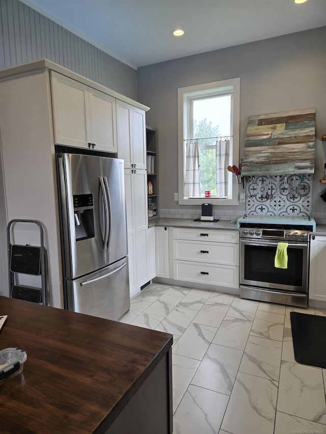 2450 N Lakeshore Rd, Carsonville, MI 48419 - kitchen featuring stainless steel appliances, recessed lighting, exhaust hood, light marble finish flooring, and open shelves