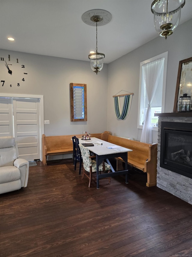 2450 N Lakeshore Rd, Carsonville, MI 48419 - dining area with wood finished floors and a fireplace