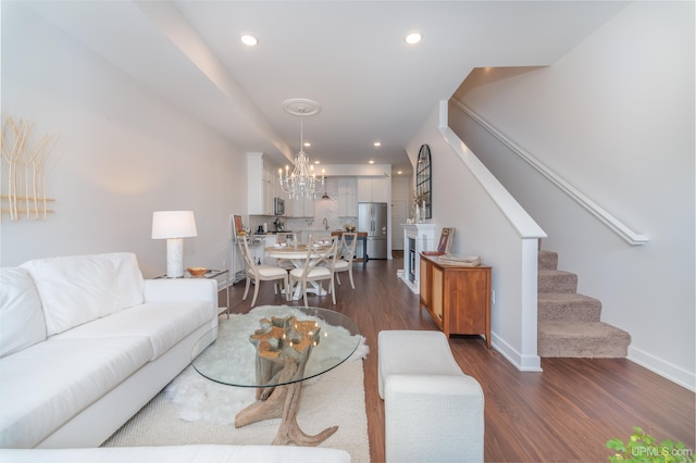 776 S Lakeshore Blvd, Marquette, MI 49855 - living room with a chandelier, stairs, dark wood-style flooring, baseboards, and recessed lighting