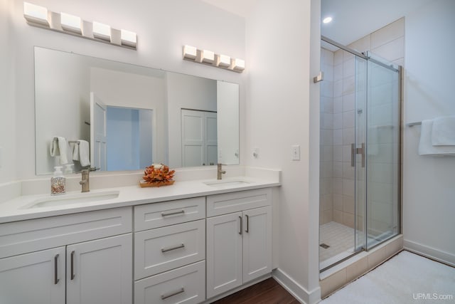 776 S Lakeshore Blvd, Marquette, MI 49855 - full bath featuring double vanity, a stall shower, and baseboards