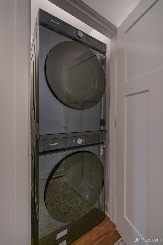 776 S Lakeshore Blvd, Marquette, MI 49855 - laundry room with stacked washer and clothes dryer and wood finished floors