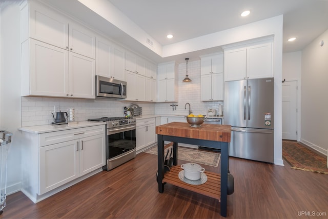 776 S Lakeshore Blvd, Marquette, MI 49855 - kitchen with stainless steel appliances, dark wood-style floors, white cabinets, and recessed lighting