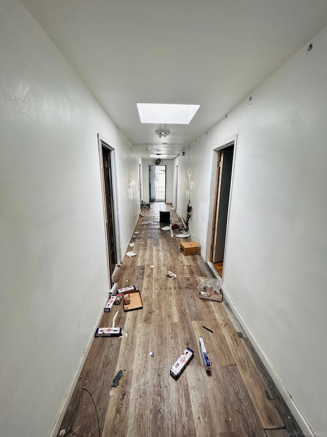16600-16620 Greenfield Rd, Detroit, MI 48235 - hall with a skylight, wood finished floors, and baseboards