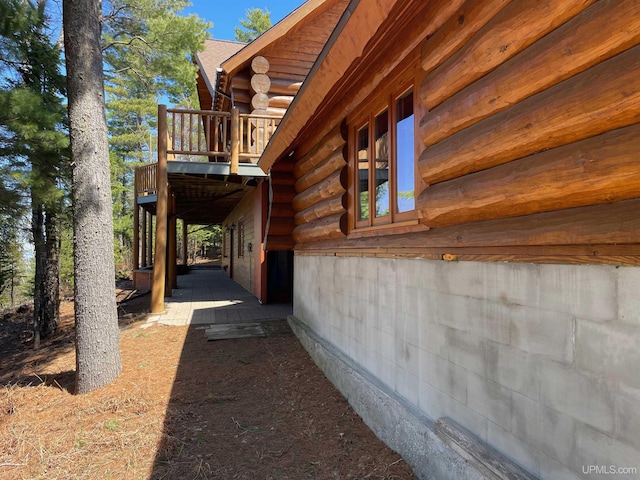 6856 Five Mile Point Rd, Allouez, MI 49805 - view of home's exterior with log siding and a wooden deck