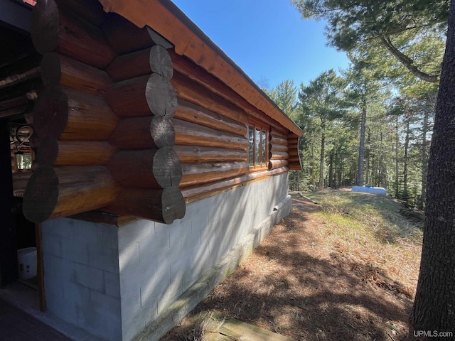 6856 Five Mile Point Rd, Allouez, MI 49805 - view of side of home with log siding