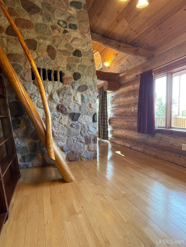 6856 Five Mile Point Rd, Allouez, MI 49805 - unfurnished living room with rustic walls, hardwood / wood-style floors, and wooden ceiling with exposed beams