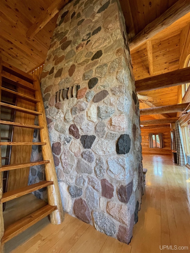 6856 Five Mile Point Rd, Allouez, MI 49805 - hallway featuring wooden ceiling, wood-type flooring, stairs, and wood walls