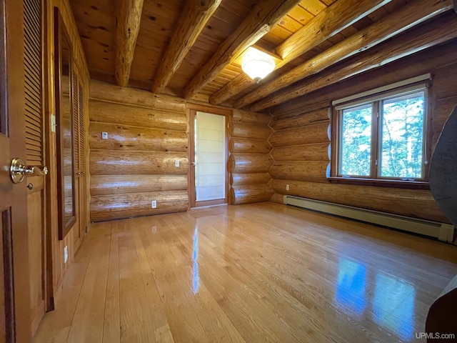6856 Five Mile Point Rd, Allouez, MI 49805 - spare room with a baseboard radiator, wooden ceiling with exposed beams, light wood-type flooring, and rustic walls