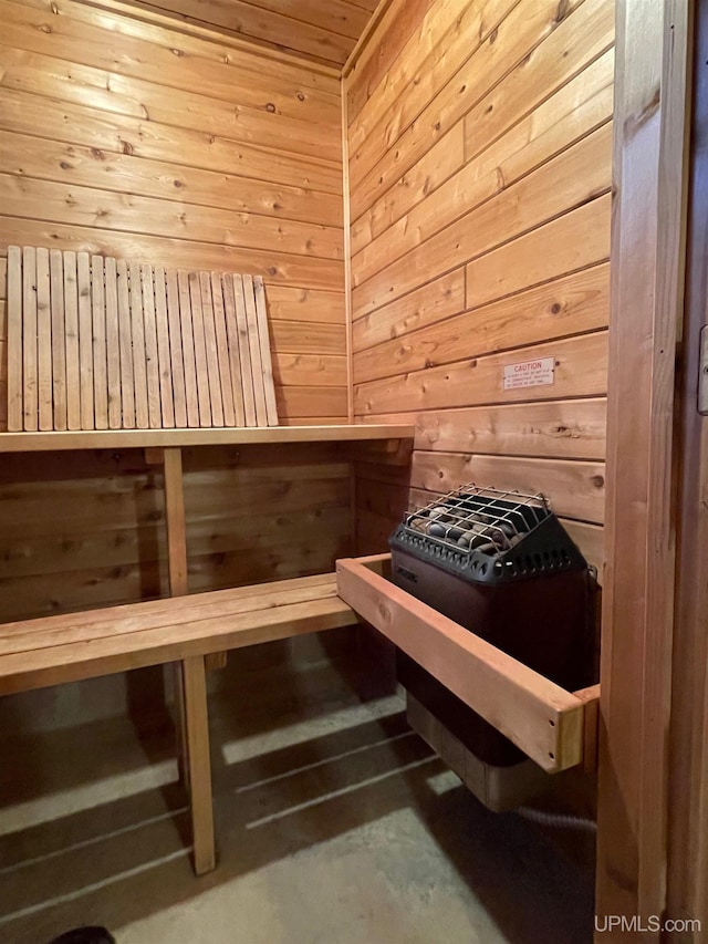 6856 Five Mile Point Rd, Allouez, MI 49805 - sauna / steam room with wood walls and unfinished concrete floors